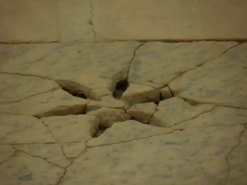 Six-pointed flower-like cross on a marble stone